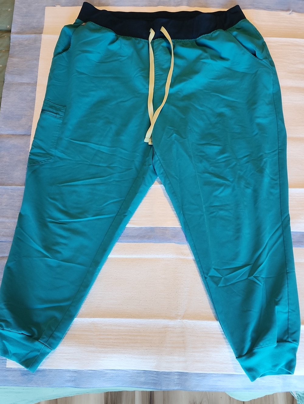 FIGS Teal Drawstring Woman Nurse Scrub with Navy Waistband and Yellow Ties